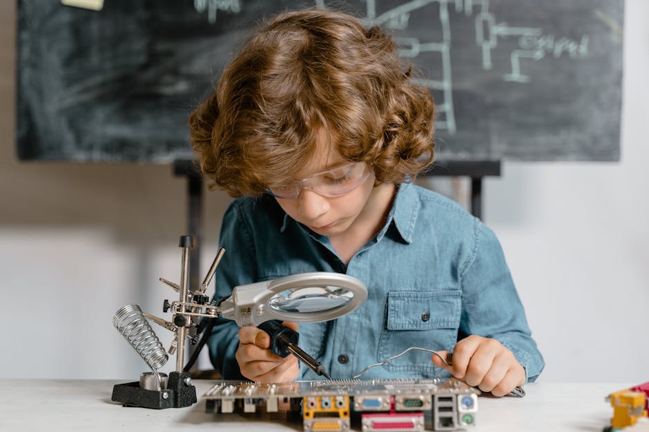 pexels-photo-8471939-8471939-2 Young boy diligently working on a circuit board, exploring science and technology.